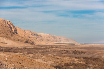 Fototapeta na wymiar Desert and road along the Dead Sea, Israel. Desert landscape, palms, oasis.