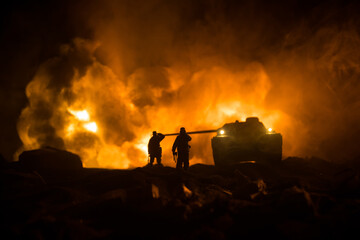 Obraz premium War Concept. Military silhouettes fighting scene on war fog sky background, World War Soldiers Silhouette Below Cloudy Skyline At night. Battle in ruined city. Selective focus