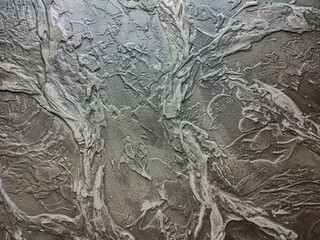 Rough texture of decorative putty in dark colors.