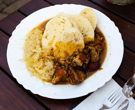 Traditional czech cuisine, moravsky vrabec with sauerkraut and potato-dough dumplings
