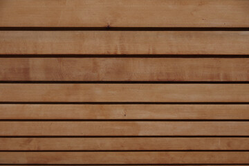 Full frame low angle view of a row of brown wooden trellis beams