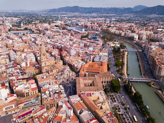 Fototapeta premium Aerial view of Murcia cityscape with a segura river and apartment buildings, Spain