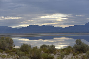 Fototapeta na wymiar Antelope Island Utah with low water levels in the Great Salt Lake at Sunset on a cloudy evening