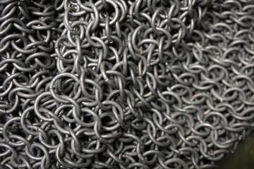 Ring armor - armor woven from iron rings, a metal net to protect against being hit by melee weapons. chain mail, shell. blacksmith product, close-up, background