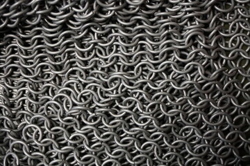 Ring armor - armor woven from iron rings, a metal net to protect against being hit by melee weapons. chain mail, shell. blacksmith product, close-up, background