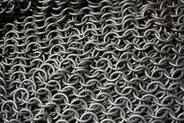 Ring armor - armor woven from iron rings, a metal net to protect against being hit by melee weapons. chain mail, shell. blacksmith product, close-up, background