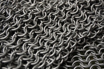 Ring armor - armor woven from iron rings, a metal net to protect against being hit by melee weapons. chain mail, shell. blacksmith product, close-up, background
