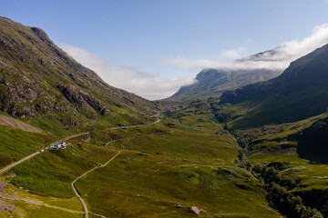Fototapeta na wymiar Aerial drone view of the beautiful valley of Glencoe in the Scottish highlands on a clear, sunny day