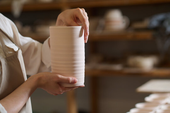 Hands Of A Potter With A New Crockery