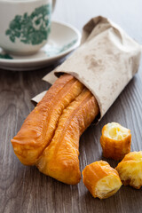 Youtiao.  Long golden brown deep fried dough strip.