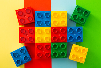 Colorful plastic block on colorful background.