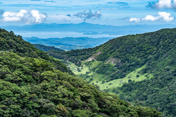 Naklejka na ściany i meble A view of the sea and mountains in Costa Rica, Monteverde