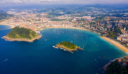 Fototapeta premium Aerial view of San-Sebastian and Beach of La Concha at sunny day, Spain..