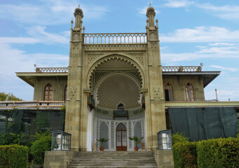 Fototapeta premium Ancient Vorontsov Palace in Alupka, Crimea on a summer sunny day. The main portal 