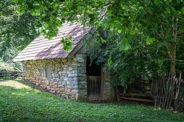 Old Springhouse under the Trees