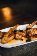 deep fried thai chicken wings with garlic, chili paste, and fish sauce