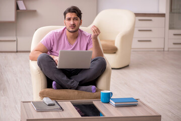 Young man working from home during pandemic