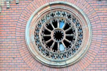 Fototapeta na wymiar Round gothic window of the small crypt in Lviv Ukraine