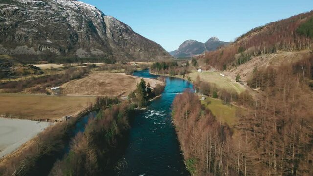 Drone flight up Ardals River in picturesque rural countryside, Norway