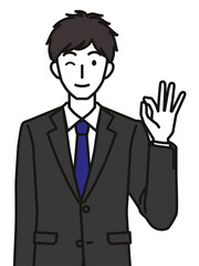 オッケーポーズのスーツを着た20代・30代男性