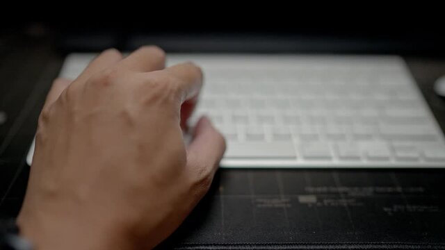 Close up human hand clicking keyboard at home 