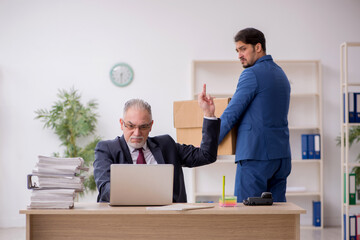 Two male employees in dismissal concept