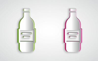 Paper cut Glass bottle of vodka icon isolated on grey background. Paper art style. Vector