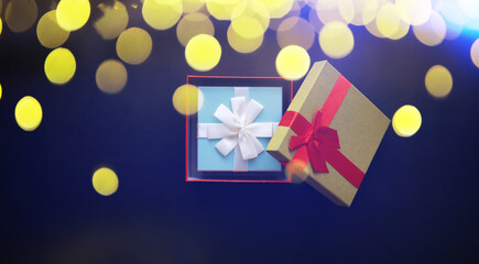 Fototapeta na wymiar Christmas decoration. Gift boxes on black stone background. Christmas greeting card concept.