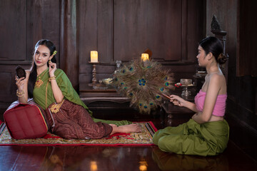 Beautiful portrait pretty Asian woman wearing in Thai dress costume traditional according Thai...