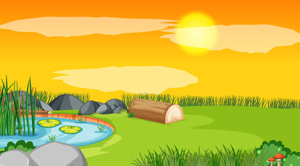 Obraz premium Landscape scene of forest with pond and the sun going down