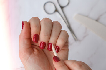 Professional trendy Hardware Manicure. Procedure for the preparation of nails. Red autumn fall...