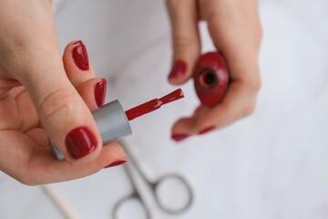 Professional trendy Hardware Manicure. Procedure for the preparation of nails. Red autumn fall...