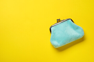 Blue wallet on yellow background