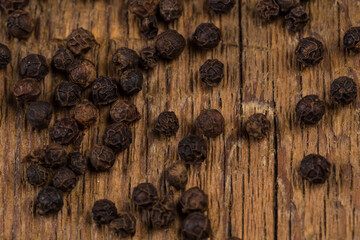 black pepper on wooden table