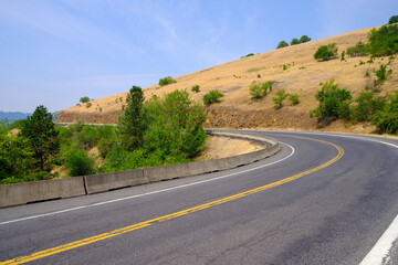 A road curves through the Nez Perce National Forest near Grangeville in Idaho, USA