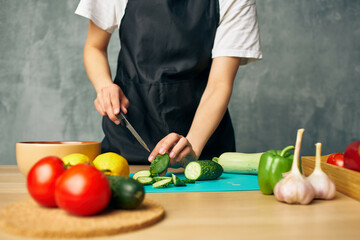 Woman in black apron Cooking healthy eating cutting board