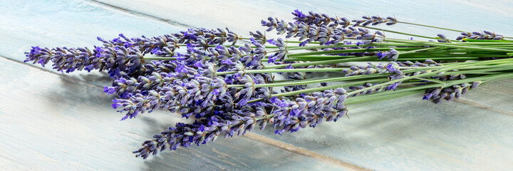 Lavender flower panorama on a rustic wooden background, a bunch of lavandula plants, a panoramic...