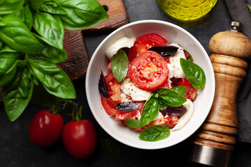 Caprese salad with fresh tomatoes, basil and mozzarella cheese