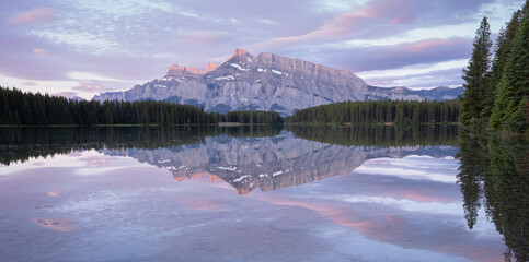 Peaceful colorful sunrise with dominant mountain reflecting on still lake´ s surface, Banff National Park,Canada