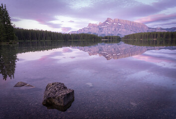 Peaceful colorful sunrise with dominant mountain reflecting on still lake´  s surface, Banff National Park,Canada