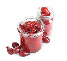 Jars of tasty dogwood jam and berries isolated on white background