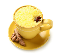 Cup of tasty turmeric latte with star anise on white background
