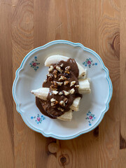 Banana with Homemade Creamy Peanut Butter and Walnuts.