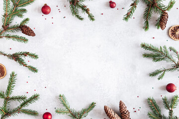 Christmas composition. Fir tree branches, red decorations on gray background. Christmas, winter, new year concept. Flat lay, top view, copy space - 462140597