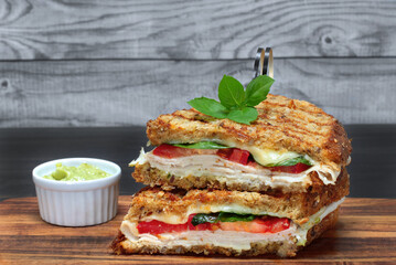 Turkey, tomato, basil, spinach and cheese panini.