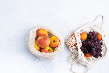 Farm apples and grapes in an eco bag. Zero waste concept