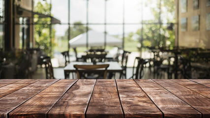 Empty wood table top and blurred coffee shop and restaurant interior background - can used for...