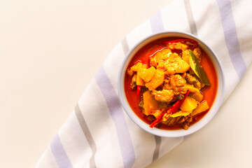 Pineapple Curry with clam and coconut in white cup. original food thailand spicy, sweet, sour taste. top view with free space. for luxury restaurant.