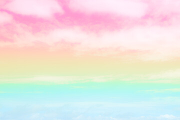 Soft focus Cloud sky rainbow pastel with colorful pink, yellow, blue fantasy paint cloudscape. gradient landscape bright light day sweet wallpaper background.