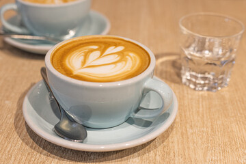 cup of cappuccino with coffee art